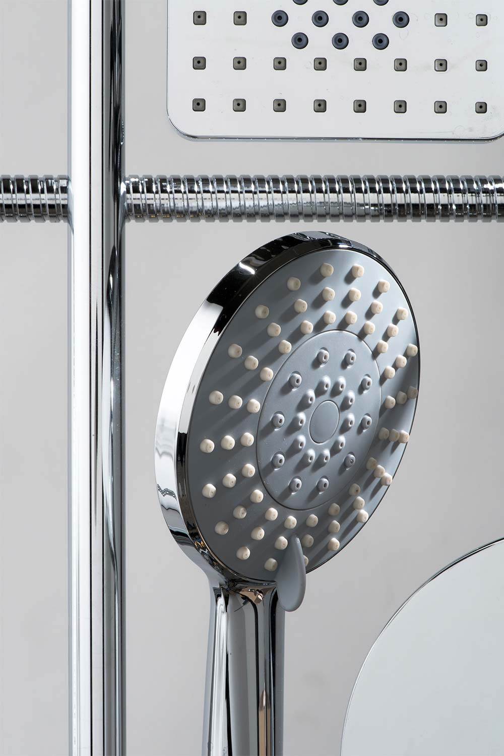 A shower rail, handset, hose and heads laid out in a graphic pattern.