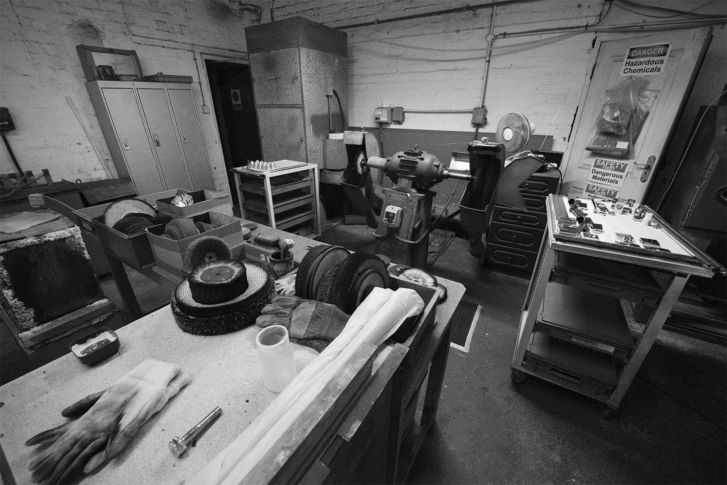 Monochrome documentary reportage photography of specialist hand finishing and plating.