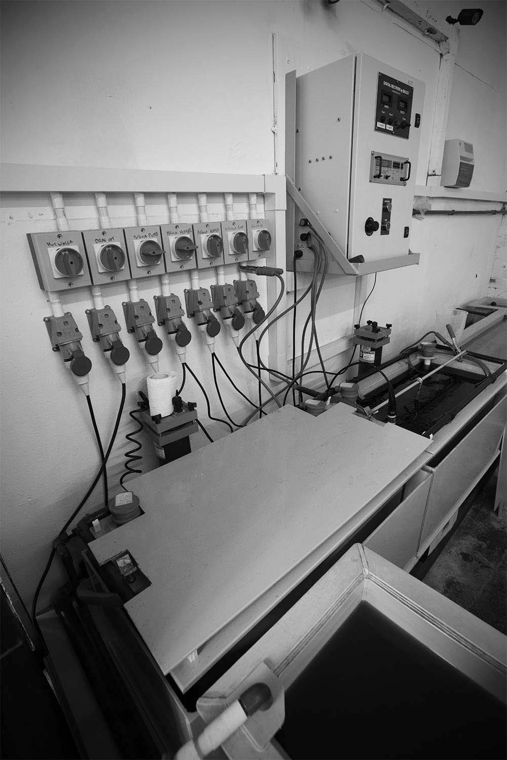 Monochrome documentary reportage photography of specialist hand finishing and plating.