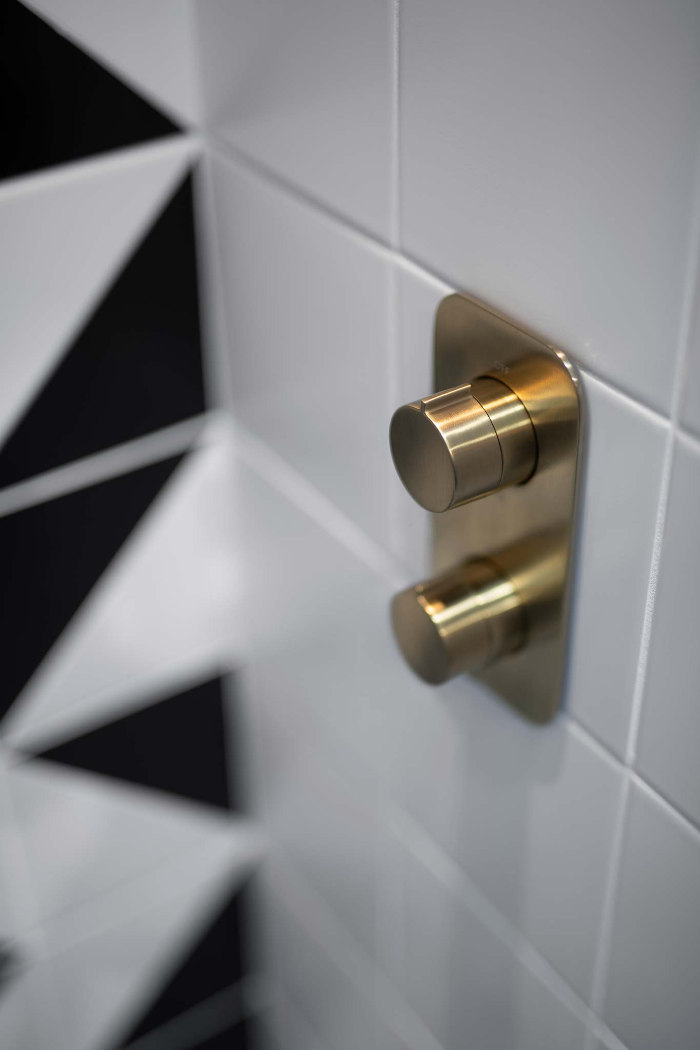 Location photography using a shallow depth-of-field of bathroom brassware, shower display